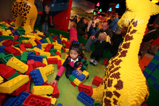 Children and families mingle around the Duplo Village inside LegoLand Discovery Center.